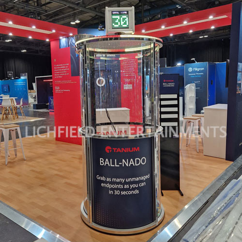Ballnado coloured ball grabbing game with branded display panels for corporate promotions at EMCC