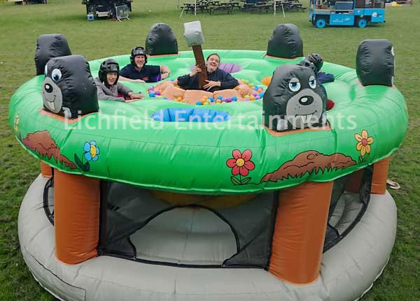 Inflatable Human Whack a Mole game for hire from Lichfield Entertainments
